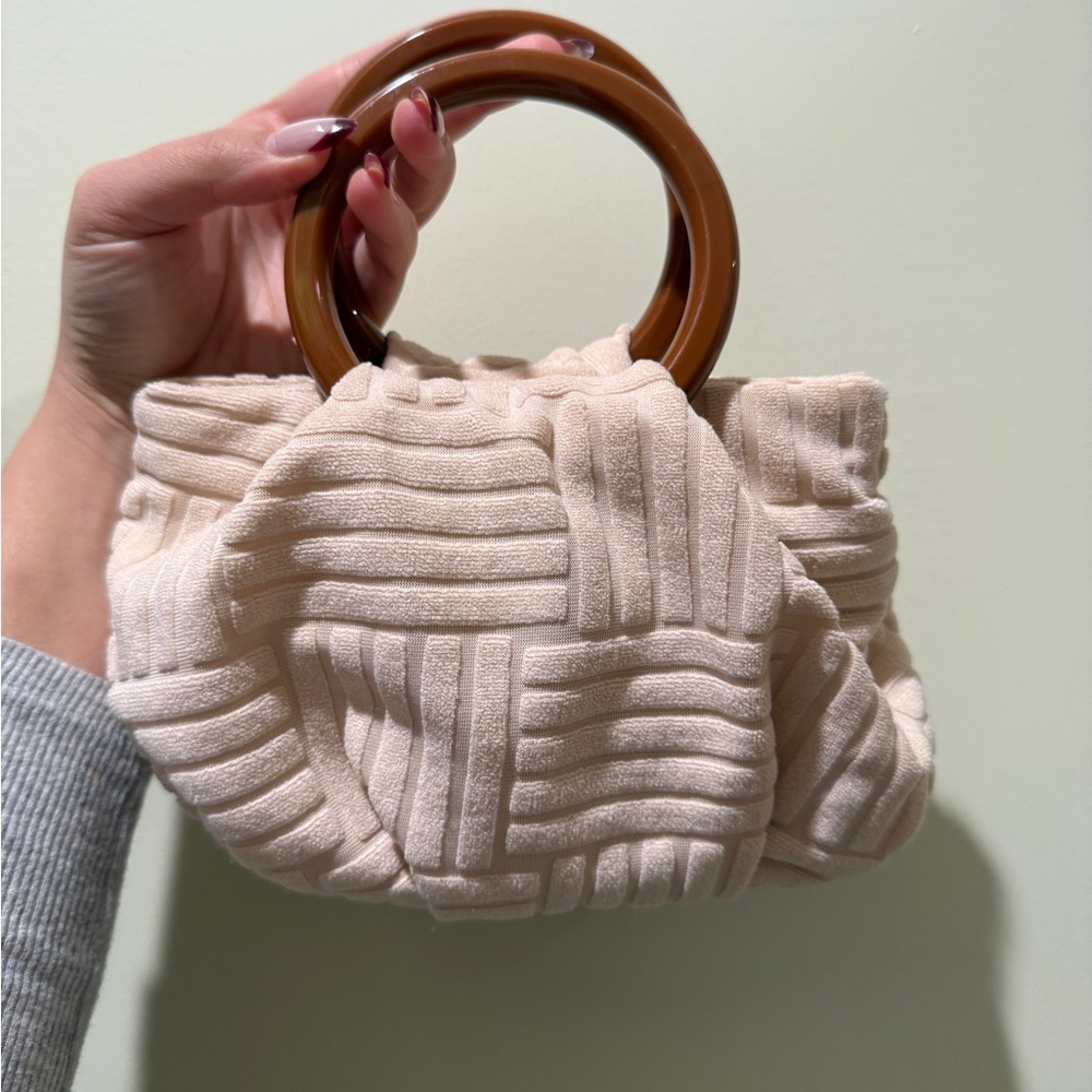 Elegant Cream Handbag with Brown Handles